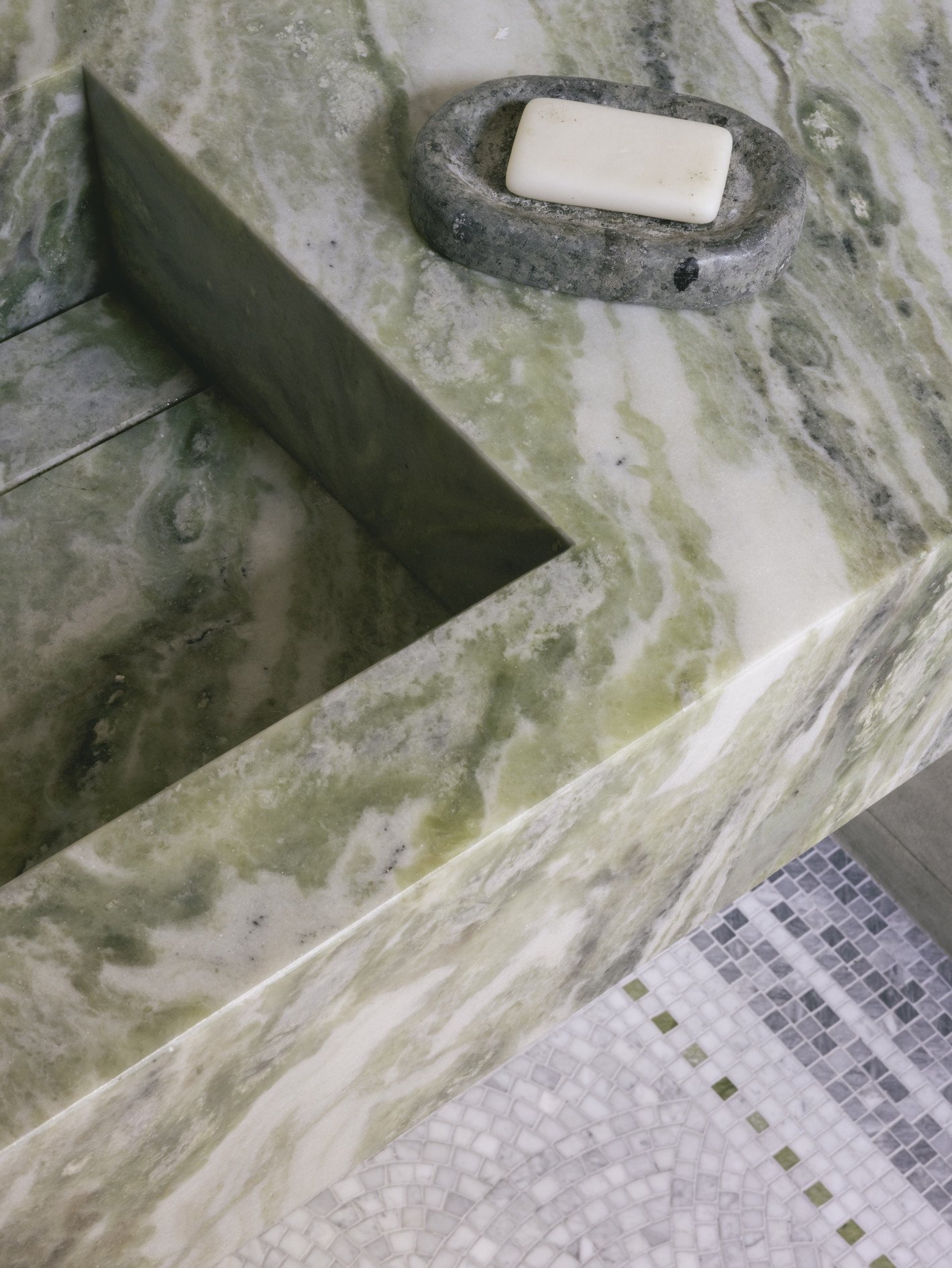 mwai a home reimagined guest bath decorative marble sink bespoke roman mosaic flooring