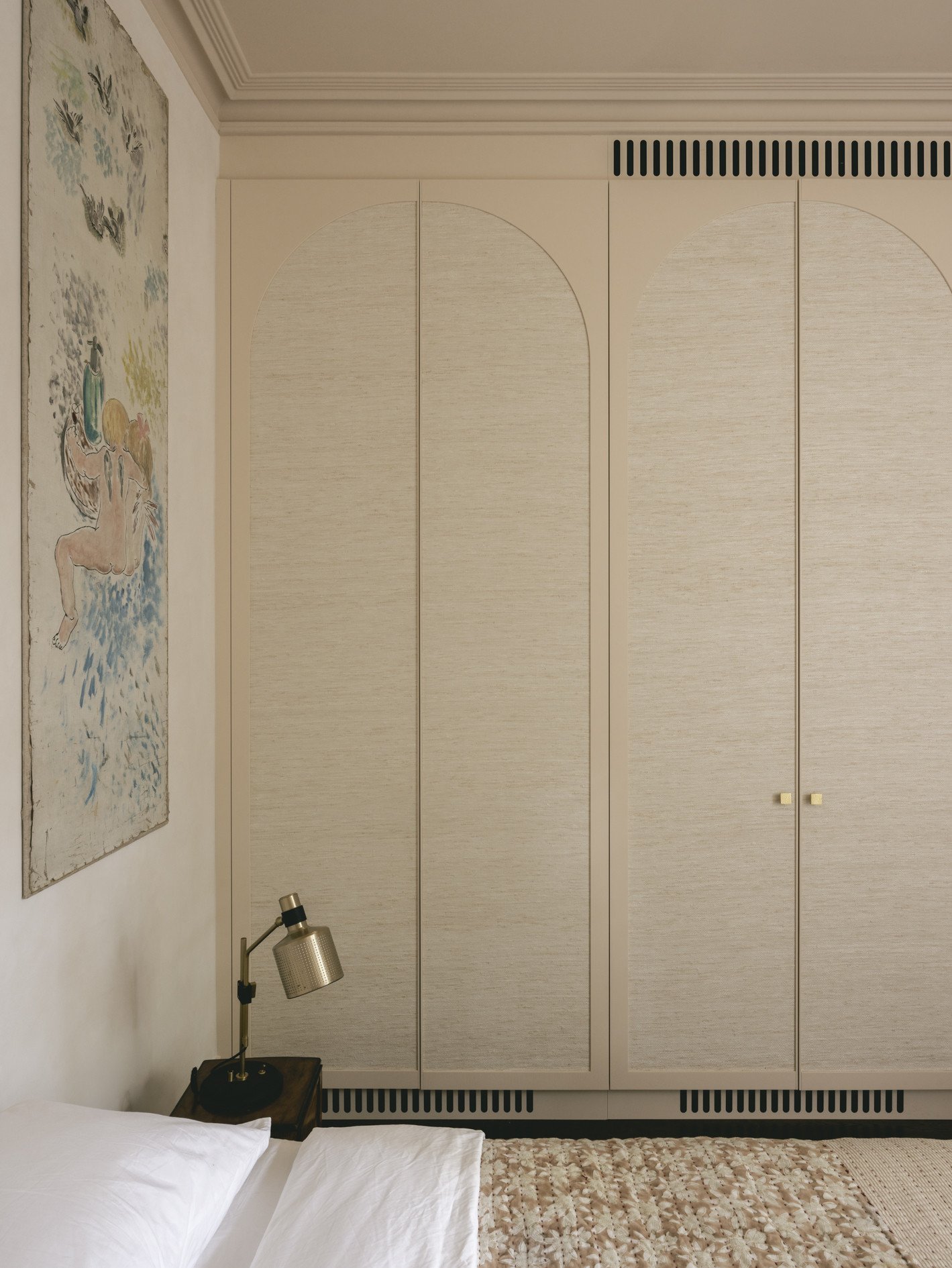 mwai a home reimagined guest bed bespoke wardrobe fabric covered arched detail to joinery