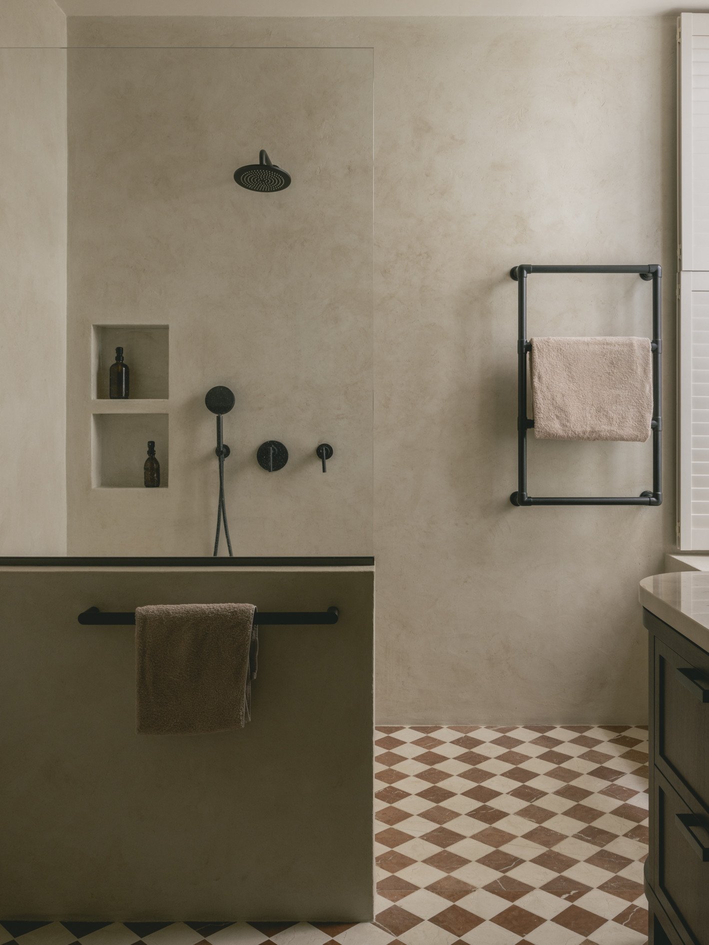 mwai a home reimagined masterbath micro cement dwarf wall minimal